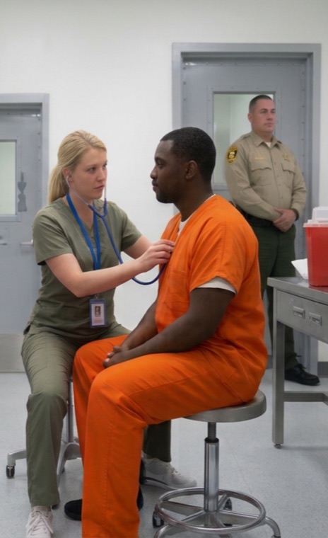 Nurse examining a patient in a correctional clinic